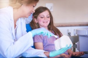 Child learning dental health in Portland, Oregon